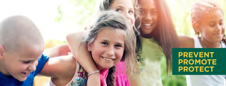 Group of children with their arms around each other