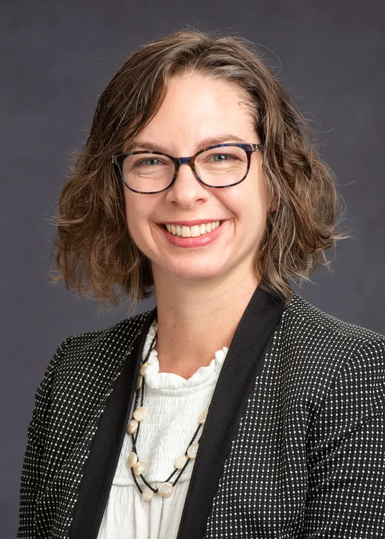 Bowsher smiling confidently at camera