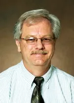 Richard smiling at the camera