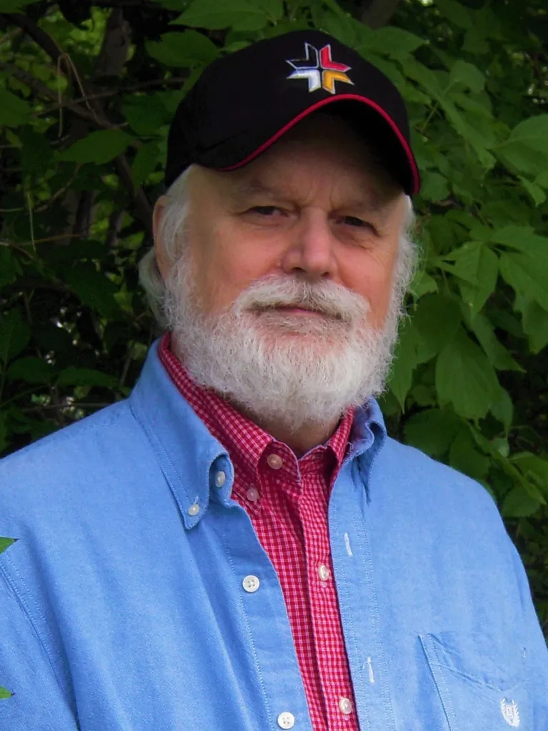 Tim smiling at the camera