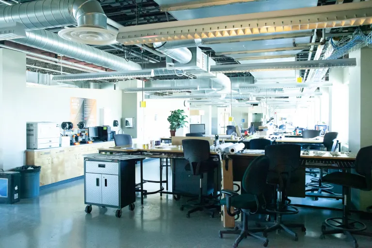 Open studio space with desks, chairs and computers in Klai Hall.