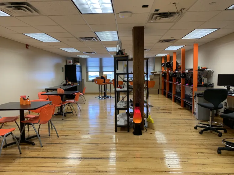 LAAVA lab with tables, chairs and computers.