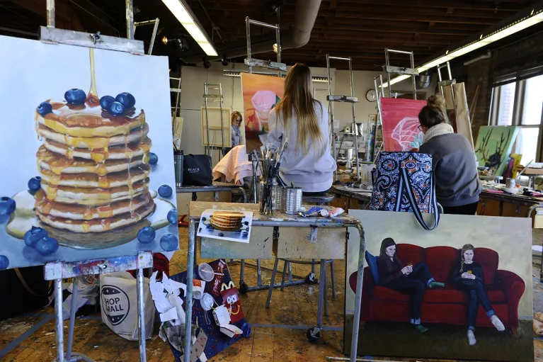 Art and art students in painting studio.