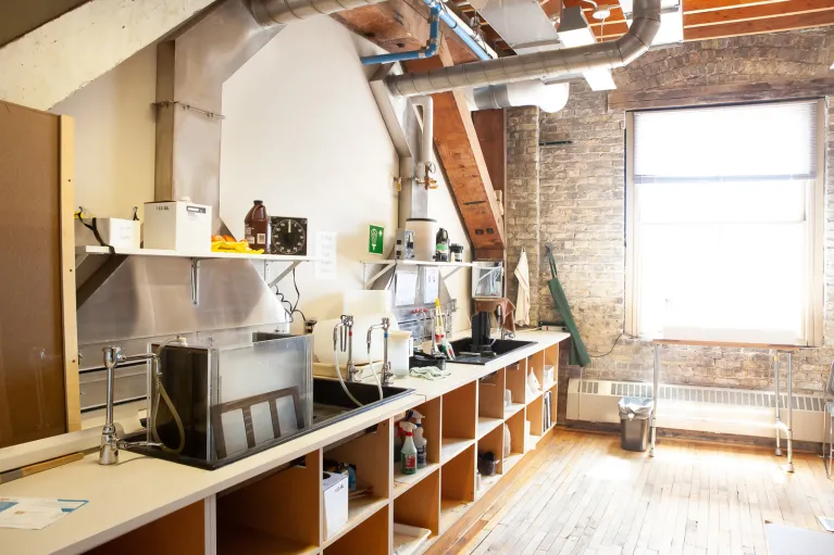 Photography studio with equipment and bench working area.