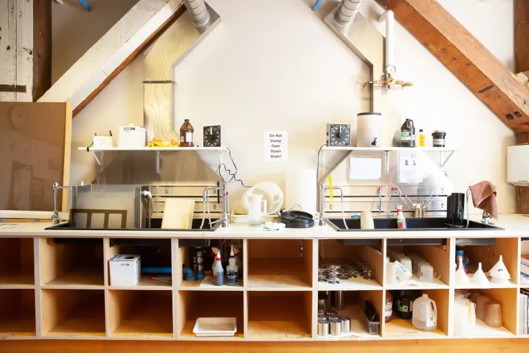 Photography studio with equipment and bench working area.
