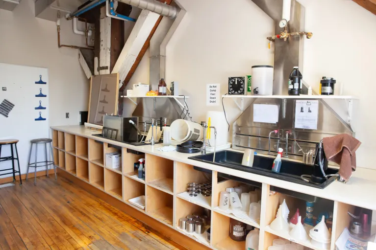 Photography studio with equipment and bench working area.