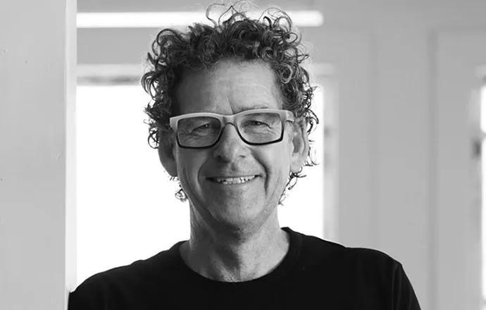 Doug Hanson smiling confidently at camera.