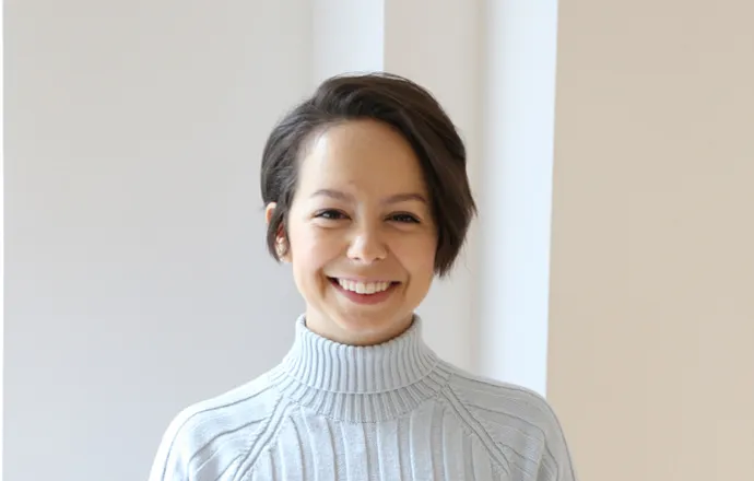 Gabrela Baierle smiling confidently at camera.