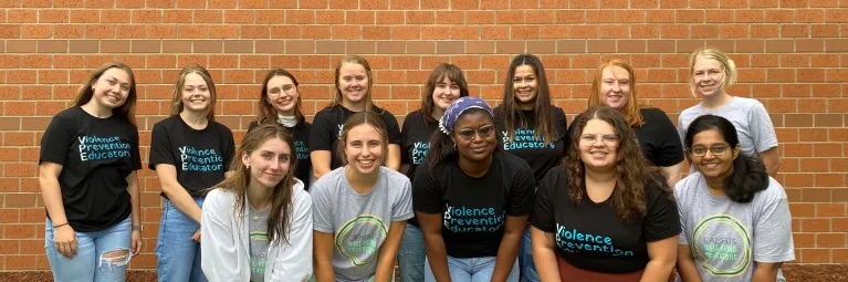 group picture of peers wearing matching t-shirts
