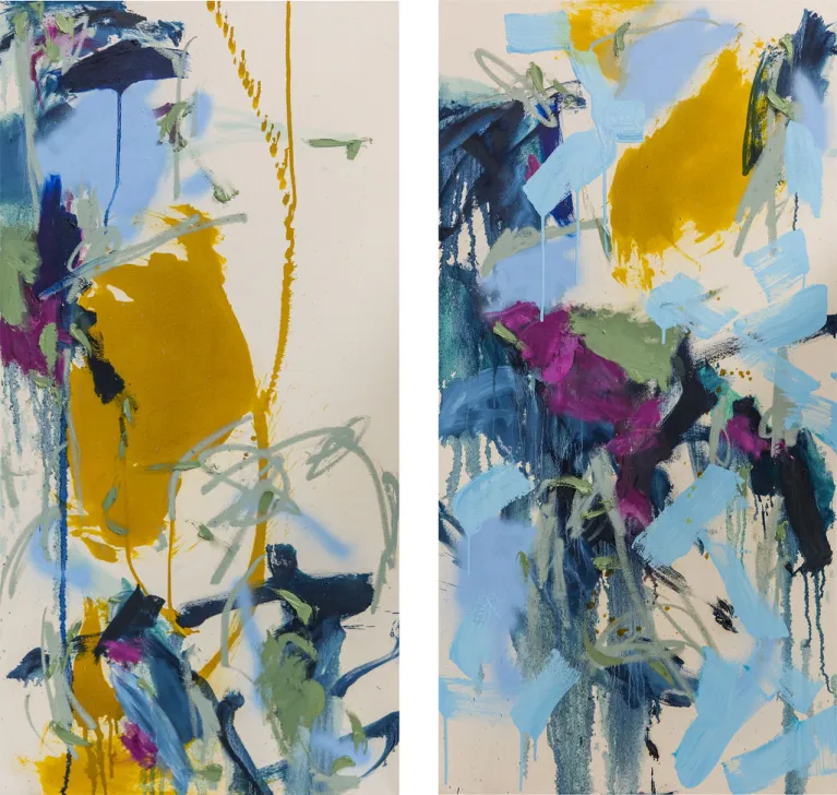 Two light colored canvases with an abstract arrangement of yellow, blue, and muted green paint