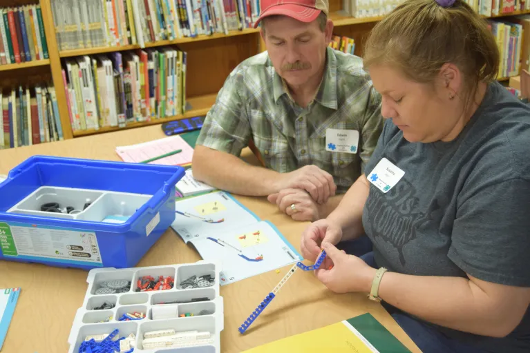 4-H Volunteers Work on a Lego Robotics Project