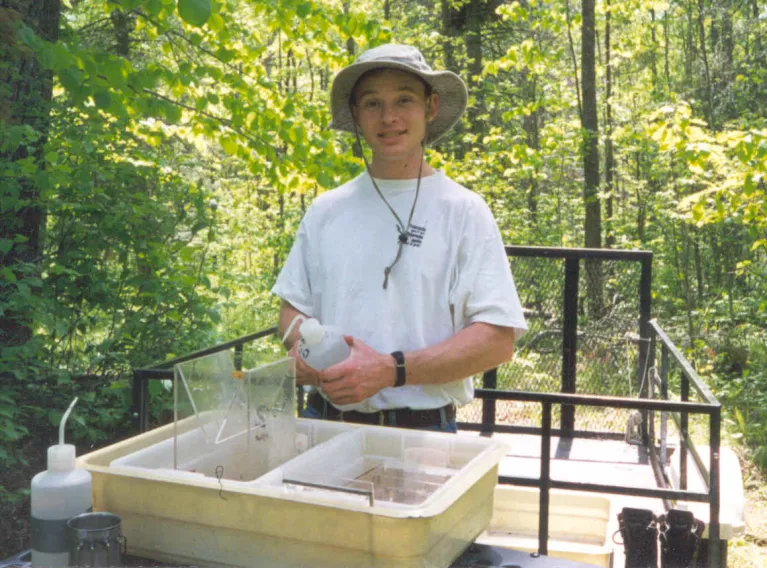 Tony rinsing out invertebrate activity traps after collection from one of the wetlands.  The traps are left out for 24hr. The 'critters' collected are preserved for later identification and enumeration.